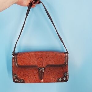 MC brown leather scrollwork embossed shoulder bag